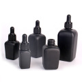 square 50ml glass bottle black colored with pump cap